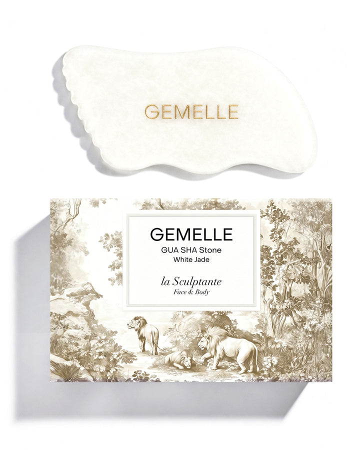 Main image of GEMELLE White Jade Gua Sha stone tool and decorative box packaging with nature-themed design on a white background